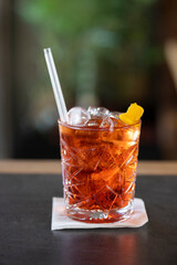 Whiskey cocktail with lots of ice served in a glass