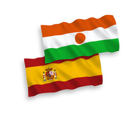 Flags of Republic of the Niger and Spain on a white background