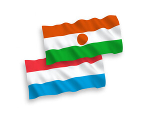 Flags of Republic of the Niger and Luxembourg on a white background