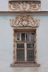 Richly stuccoed window of an old mansion