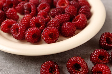 Small, red, sour and sweet fruit raspberries