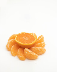 Naklejka na ściany i meble whole and slice Tangerine or komola isolated on white background, side view