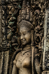 Fototapeta na wymiar A sandstone sculpture of Apsara with a beautiful face and body at Bayon Angkor Thom Temple, Siem Reap, Cambodia.