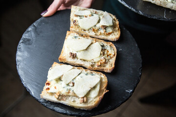 Bruschetta with pear, blue cheese and nuts