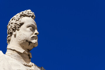 Fototapeta premium Ferdinando I Medici, Grand Duke of Tuscany. A marble statue erected in 1594 in the historical center of Pisa (with blue sky and copy space)