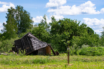 Fototapeta premium an old abandoned wooden house in the village