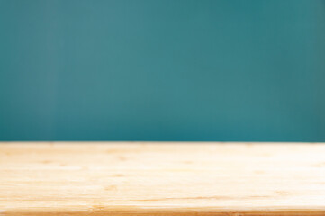 Background with blackboard and green background behind. Green net. Wooden tabletop. Light tree. Simple composition. Mockup