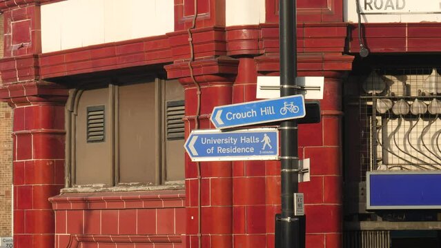 Bicycle and pedestrian signs on London street corner. United Kingdom.