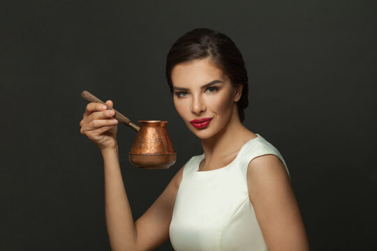 Fashion model woman brunette with coffee in ibric portrait