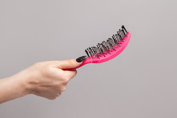 Pink hair comb and hair, hair loss concept