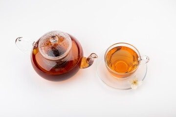Composition with cup of jasmine tea and flowers on light background