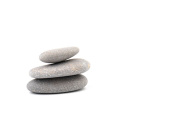 Obraz na płótnie Canvas Zen stones on a light background. Minimalistic concept. Zen balance miditation concept. For branding and product presentation.