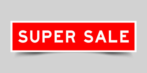 Red color square shape sticker label with word super sale on gray background