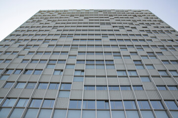Facade of a building with many windows. The building is for office use.