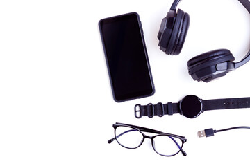Smartphone,Smartwatch,Black Headphone,Black Wallet,USB cable and Eyeglasses on White background