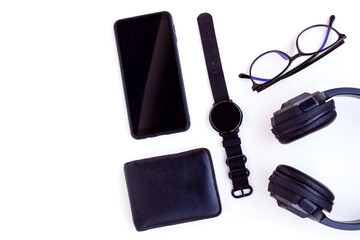 Smartphone,Smartwatch,Black Headphone,Black Wallet and Eyeglasses on White background