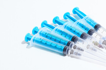 Disposable plastic syringe prepared for injection and vaccination in the hospital. The concept of medicine and health