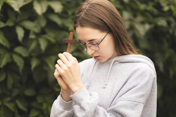 Close-up of hands on the Bible. The process of studying the Bible. Prayer and worship of God. Study of the Holy Scriptures. Studying in theological seminary. Theology.