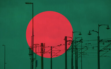 Bangladesh flag with tram connecting on electric line with blue sky as background, electric railway train and power supply lines, cables connections and metal pole overhead catenary wire