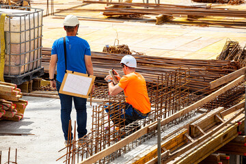 Surveyors at the construction site using GPS mapping