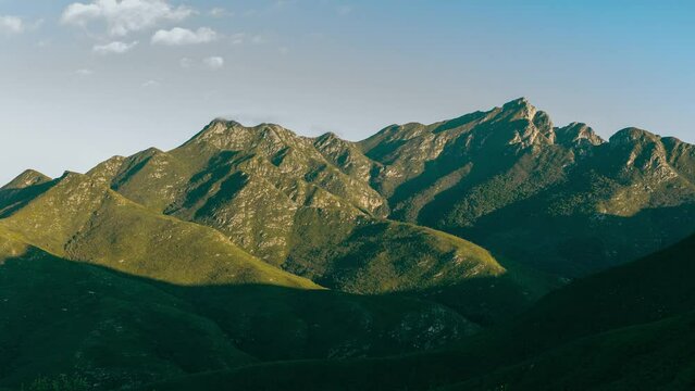 4K Time lapse of mountains. George and Cradock peak part of the Outeniqua mountains in the morning with clouds.