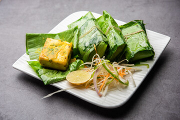 patrani paneer, a paneer marinated in sauce and barbecued and then covered in leaf