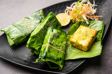 patrani paneer, a paneer marinated in sauce and barbecued and then covered in leaf