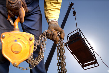 Safety workplace close up image of trained competent rigger high risk worker wearing safety heavy...