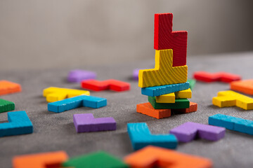 Creative idea solution - business concept, jigsaw puzzle on the grey background. Leadership and teamwork strategy success.