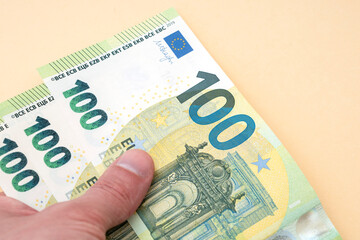 Person holding 300 euro money - obrazy, fototapety, plakaty