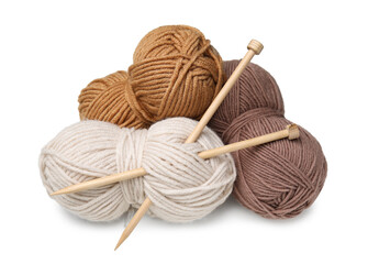 Soft woolen yarns and knitting needles on white background