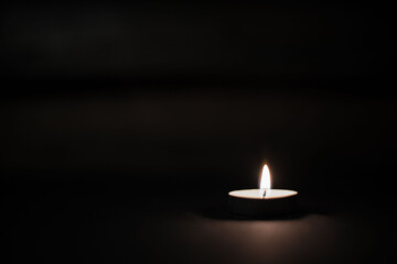 candle on a black background