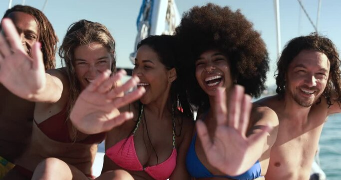 Happy multiracial friends doing sea tour with sailing boat - Summer and vacation concept