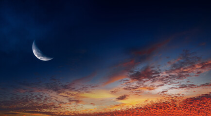 sunset sky with crescent moon