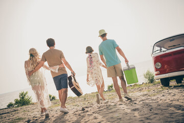Photo of funny fellows enjoy road trip finish party prepare travel home wear casual outfit nature seaside beach outdoors