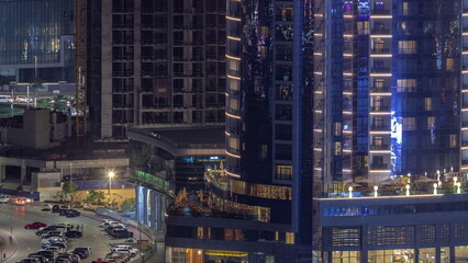Fototapeta na wymiar Cityscape of skyscrapers in Dubai Business Bay aerial night timelapse