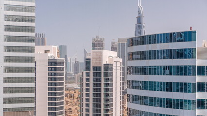 Skyscrapers in Dubai Business Bay and financial district aerial timelapse.