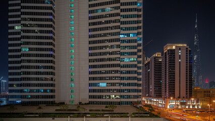 Fototapeta na wymiar Aerial panoramic view to Dubai downtown skyscrapers night timelapse.