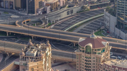 Bussy traffic on the overpass intersection in Dubai downtown aerial timelapse.