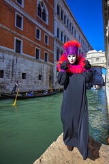Traditional Venetian mask at Carnival with the Bridge of Sighs, Venice, Italy