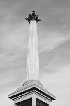 Trafalgar Square - Nelson's Column in London UK. Black and white vintage photo style.