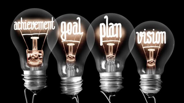 Light bulbs going from dark to light with Achievement, Plan, Goal and Vision text on black background. High quality 4k video.
