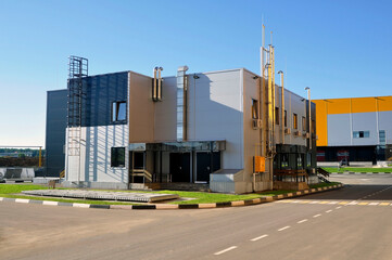 Fototapeta na wymiar A modern prefabricated office building made of steel structures, sheathed with sandwich panels.