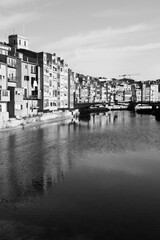 Naklejka premium Girona town in Spain. Black white photo vintage style. Spanish landmark.
