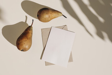Summer still life composition. Autumn weddding greeting card, envelope mock up scene. Two pears...