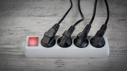 The power plugs and a one multi socket electrical splitter with the surge protection.