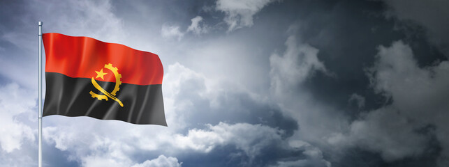 Angolan flag on a cloudy sky