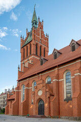 Fototapeta na wymiar Brick building of the Catholic Church of the Holy Family