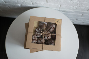 Boxes of pastries are on a white table