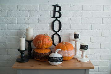Interior decoration in autumn in the style of Halloween, with the inscription boo